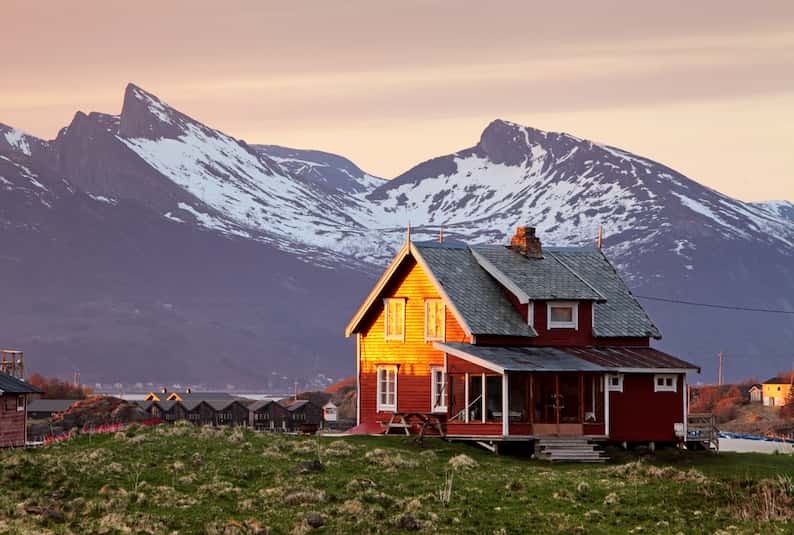 house in Norway next to a mountain