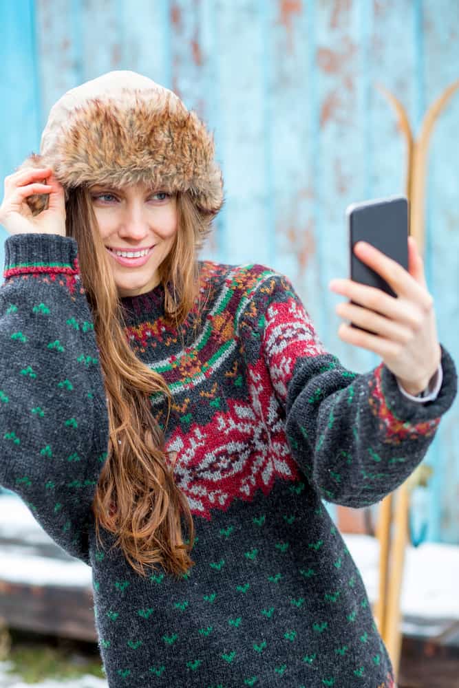 woman taking a selfie in winter clothing