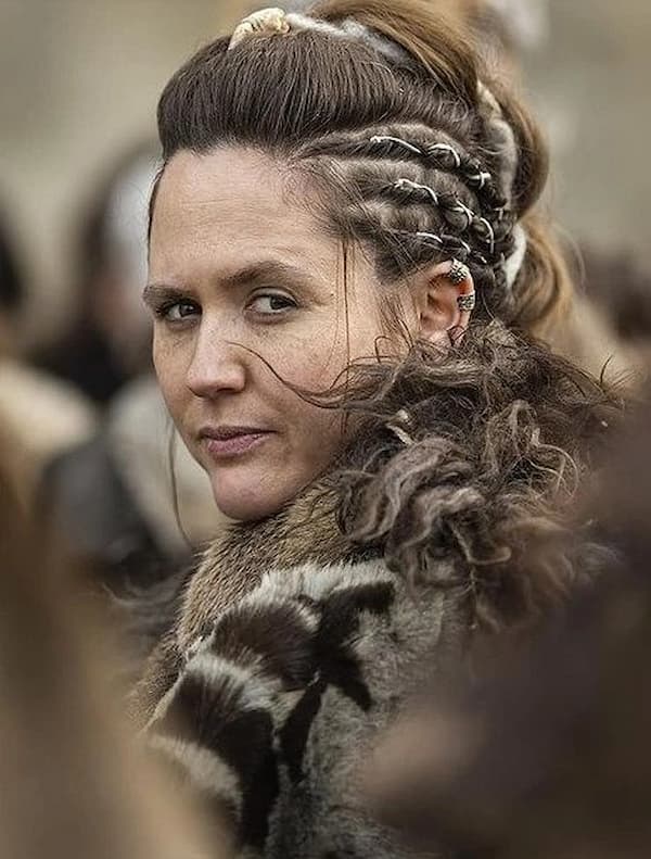 a Viking character from The Last Kingdom, wearing Viking ear cuffs